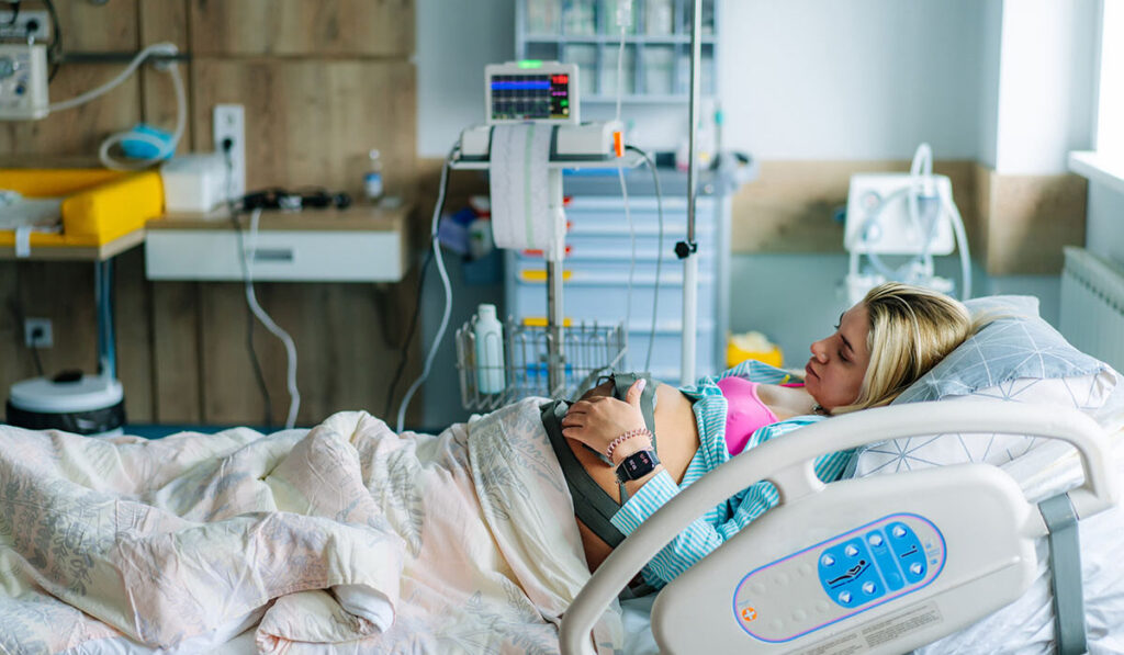 Young patient maternity clinic. Pregnant woman in hospital modern room.